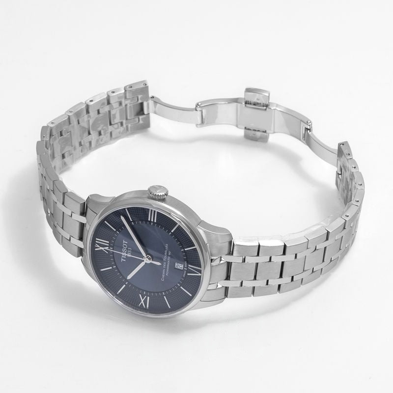 tissot-chemin-des-tourelles-bleu-acier-maroc.jpg Montre Tissot Chemin des Tourelles Powermatic 80 avec cadran bleu soleillé et chiffres romains sur bracelet acier.